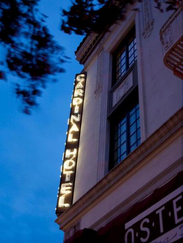 a lit up sign on the side of a building at Cardinal Hotel in Palo Alto