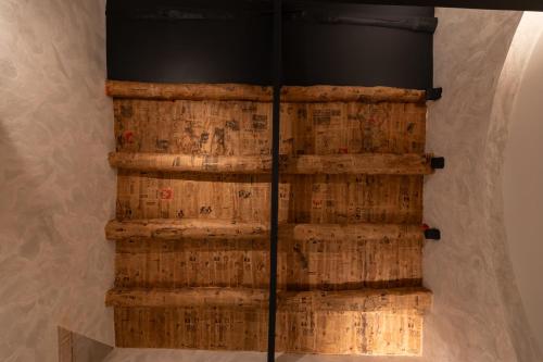 a wall of wine barrels in a room at Relais Ammira in Naples