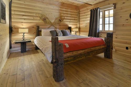Les Chalets de Môh - 14 chalets indépendantsにあるベッド