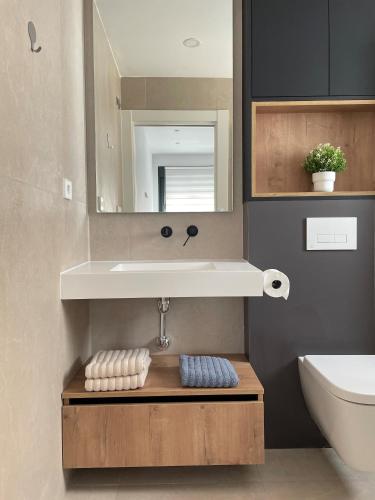 a bathroom with a sink and a mirror at Casa Diana Golf in Murcia