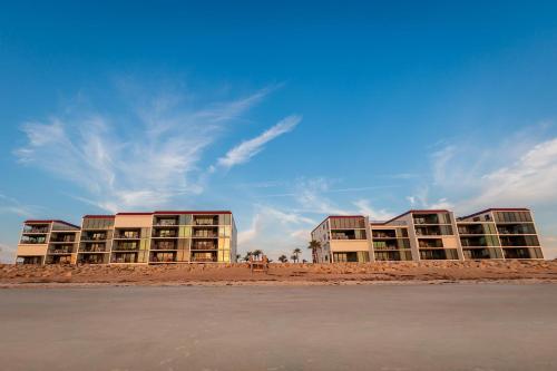 a row of apartment buildings on the beach at Chadham by the Sea 413 in New Smyrna Beach