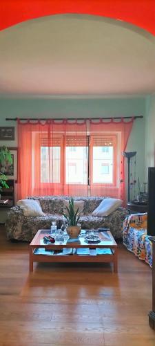 a living room with a couch and a coffee table at La Casita b&b in Bagnoregio
