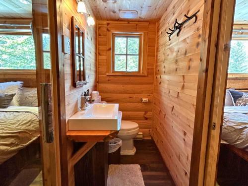 Les Chalets de Môh - 14 chalets indépendantsにあるベッド