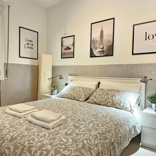 a bedroom with a large bed with pillows on it at San Donato Policlinico BBking in San Donato Milanese