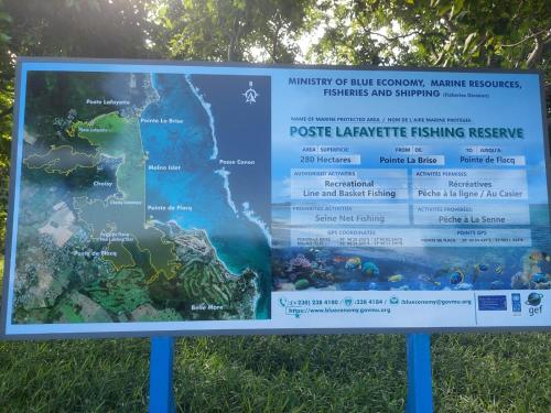 a sign for a park with a map at Sunshine Residence Holiday Apartments Mauritius in Poste Lafayette