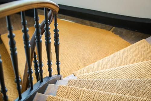 a set of stairs with a wooden hand railing at Schloss Suggenstein in Sigmaringen