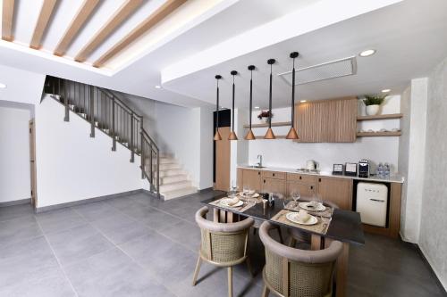 a kitchen and dining room with a table and chairs at Ethno Belek in Belek