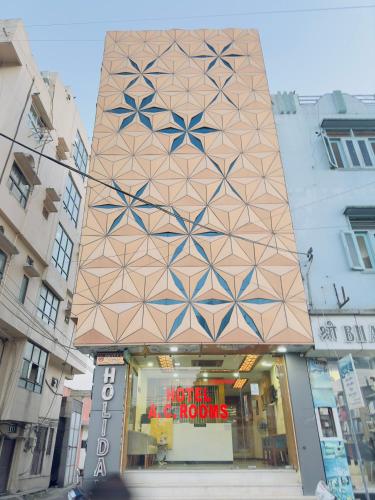 a store front of a store with a building at Hotel New Holiday in Bhilwara