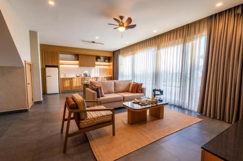 a living room with a couch and a table at Ethno Belek in Belek
