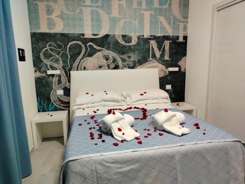 Łóżko lub łóżka w pokoju w obiekcie B&B Villa Fabrizia