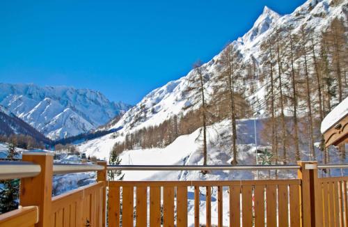 a balcony with a view of a snow covered mountain at Apart Prieth Samnaun in Samnaun
