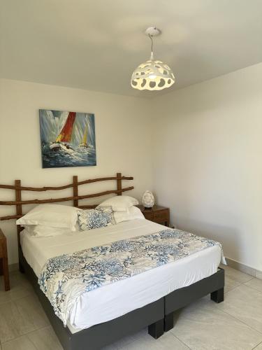 Postel nebo postele na pokoji v ubytování Majesty Palm Hôtel