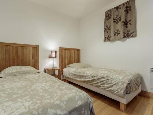 Postel nebo postele na pokoji v ubytování Appartement ski aux pieds, 2 chambres, parking couvert inclus - FR-1-352-4
