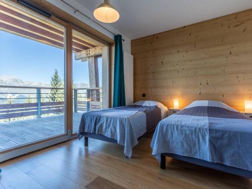 Ένα ή περισσότερα κρεβάτια σε δωμάτιο στο Les Arcs 1800 : Appart lumineux 3P, sauna, hammam, proche pistes, 6 pers - FR-1-352-60