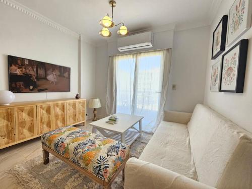 a living room with a couch and a table at Our home Our heaven in Madinaty
