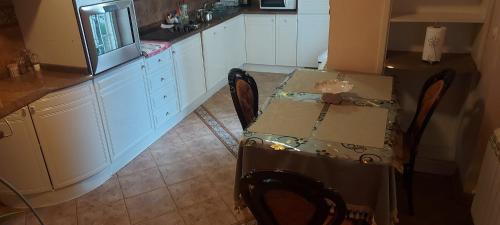 a kitchen with a table with a box on it at Michael's Classy Apartment in Belgrade