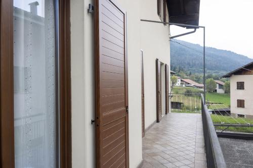 a door to a balcony with a view of a mountain at Da Tiziana in Balbido-rango