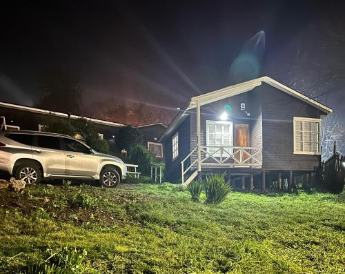 a car parked in front of a house at night at Casa en Lota central con tinaja in Lota