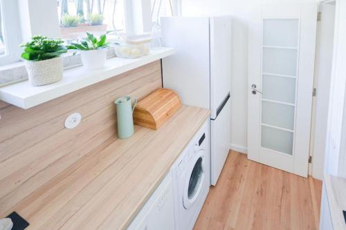 a laundry room with a washer and dryer at Cascais Center Family Apartment with Courtyard in Cascais