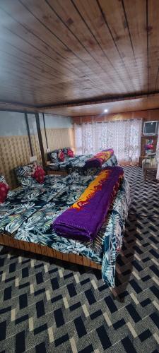 a bedroom with two beds in a room at New snow view resort pahalgam in Pahalgām