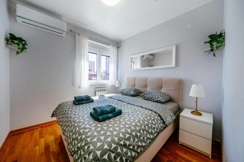 Ένα ή περισσότερα κρεβάτια σε δωμάτιο στο Penthouse Belgrade