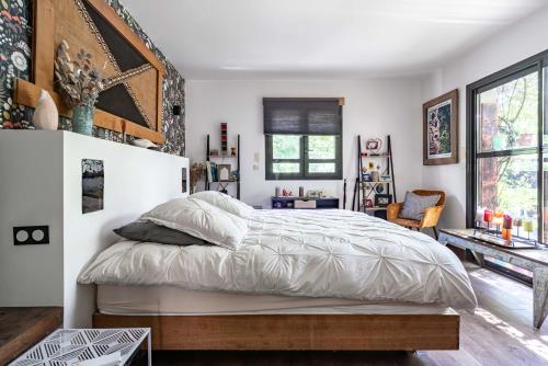 Ένα ή περισσότερα κρεβάτια σε δωμάτιο στο LA MAISON DU BONHEUR