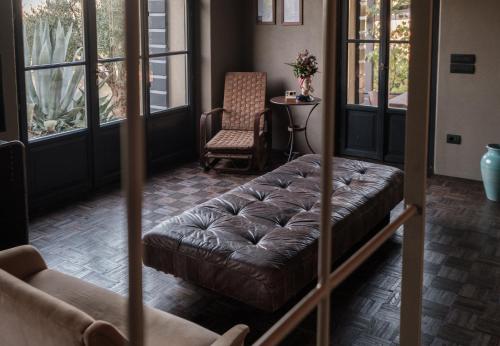 a living room with a couch and two chairs at Podere San Pasquale in Castiglione dʼOrcia