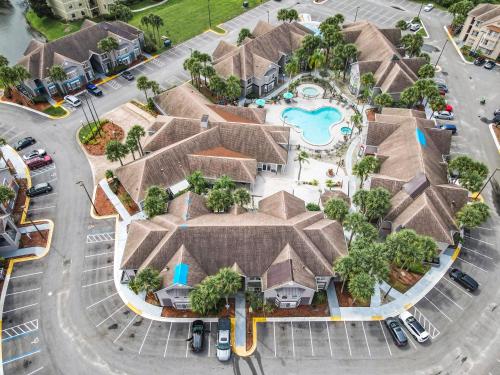 an overhead view of a house with a pool at Be Our Guest! 1 Bedroom Condo Near Disney Parks! in Orlando