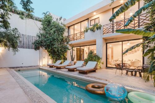 an image of a house with a swimming pool at Villa Sorella in Aldea Zama 24Hrs Security, 5min to the beach in Tulum