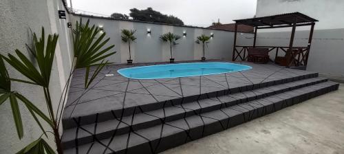 Πισίνα στο ή κοντά στο Casa na praia com piscina pontal do Paraná