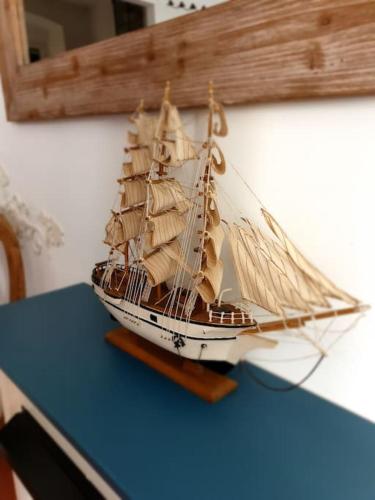 a toy boat sitting on top of a table at Glimpse of Paradise Beach with Parking in Sori