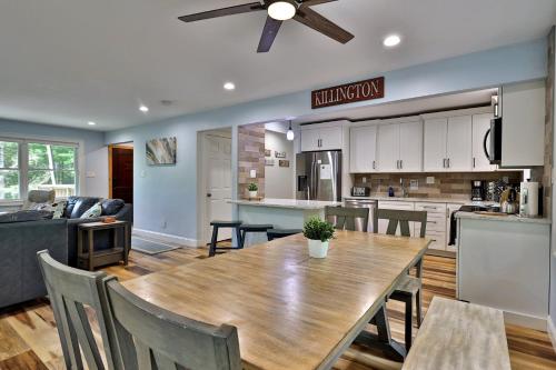 a kitchen and dining room with a wooden table and chairs at Fun In Fun Out Ski Home - Upper Unit, Renovated 3BR-2BA, Hot Tub, Close to Resort in Killington
