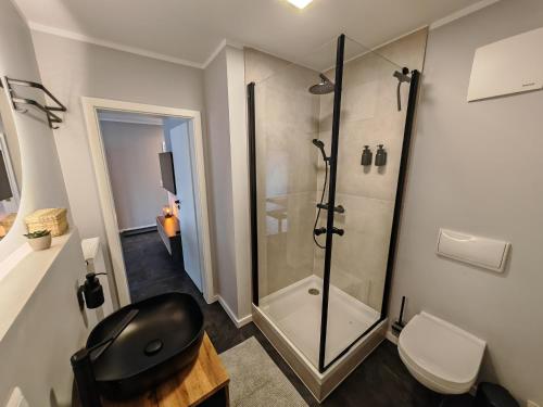 Ένα μπάνιο στο Sunnybelle Appartements Freital I