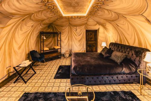 a bedroom with a bed in a tent at Castello Brancaccio in San Gregorio da Sassola