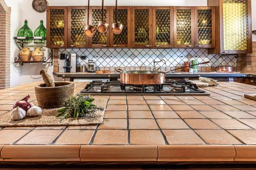 a kitchen with a stove with a pot on it at Copper House in Lanciano