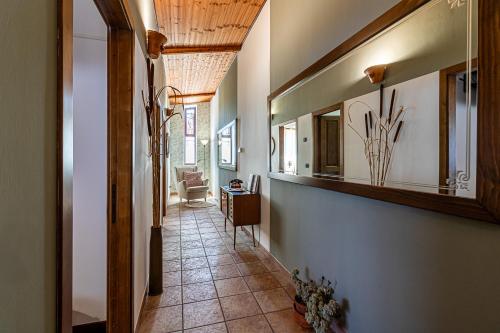 a hallway of a home with a tile floor and a ceiling at Copper House in Lanciano