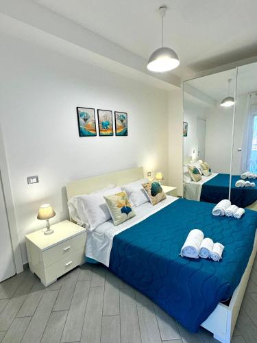 Ένα ή περισσότερα κρεβάτια σε δωμάτιο στο Suites Dreams Fiumicino Isola