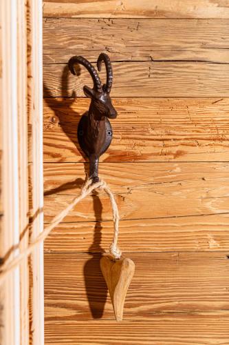 a hook on a wall with a heart on it at Das Kitz - Chalet Steuerberg XL Kitzbühel in Kitzbühel