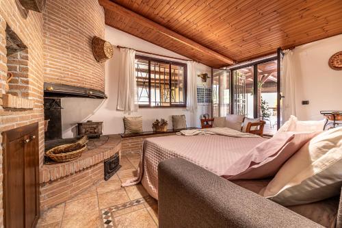 a bedroom with a bed and a fireplace at Copper House in Lanciano