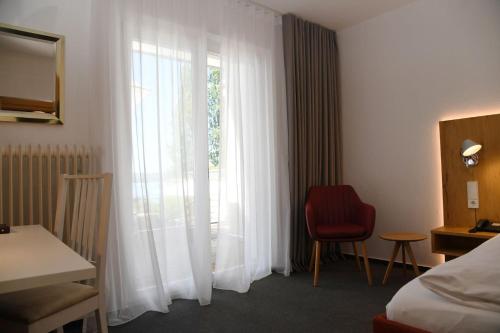 Кровать или кровати в номере Strandhotel Seehof
