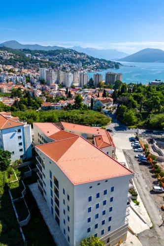 an aerial view of a city and the ocean at Apart hotel M S KATUNJANIN in Herceg-Novi