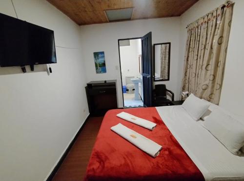 Cama o camas de una habitación en Hotel Ricocampo