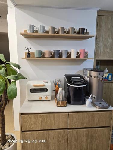 a kitchen counter with a coffee maker and a toaster at stay110 in Seoul
