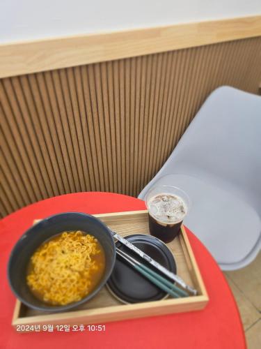 a tray with a bowl of food on a table at stay110 in Seoul