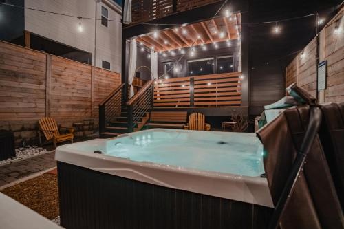 a jacuzzi tub in the middle of a building at Luxurious 4bd home sleeps 12 minutes to downtown with parking in Nashville