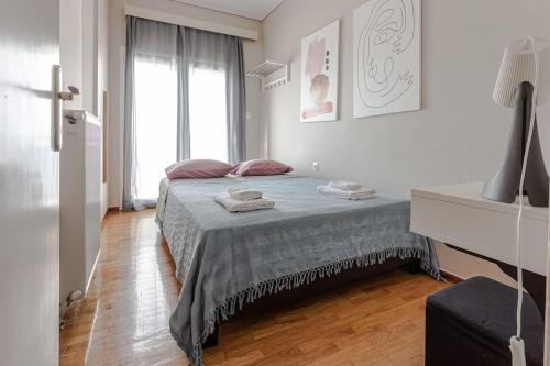 Ένα ή περισσότερα κρεβάτια σε δωμάτιο στο Minimal Central Apartment By The Sea