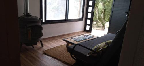 a living room with a couch and a wood stove at DarAlRayhan in Ain Draham