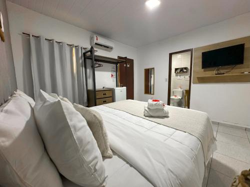 Uma cama ou camas num quarto em Casa Flôr