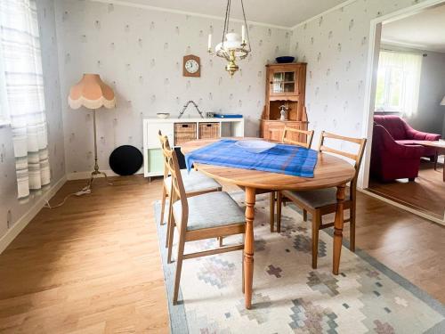 a dining room table and chairs in a kitchen at 4 person holiday home in TINGSRYD in Tingsryd