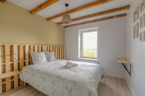 Postel nebo postele na pokoji v ubytování New maison au coeur des vignes